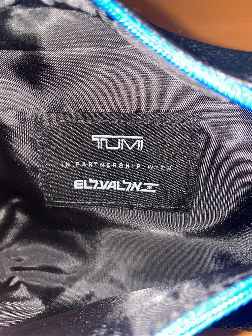 TUMI Woman’s Cosmetic Black and Blue Bag